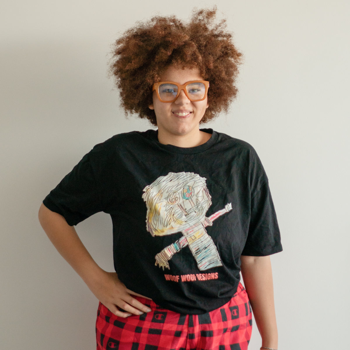 Sikiraa wearing an original Woof Woof Designs art T-shirt